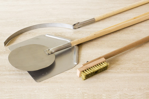 Utensils for wood fired ovens