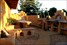 Adobe, mud-brick, mosaic, courtyard, art, creative, water feature, outdoor fireplace, concrete bench-top